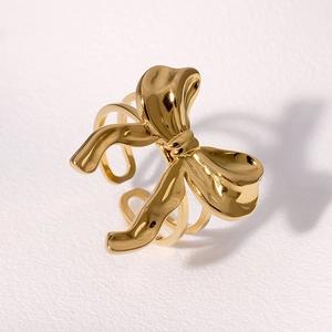 Elegant gold bow-shaped stainless steel ring with an adjustable open band design