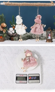 Detailed view of pink and white plush angel ornaments with weight display for holiday decor