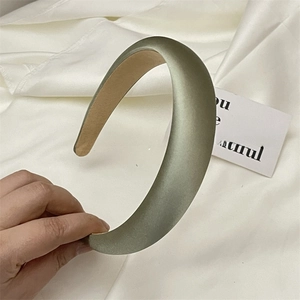 Detailed view of Morandi green satin padded headband with soft silky texture and anti-slip lining