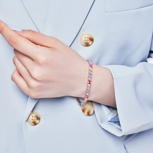 Close-up of a S925 sterling silver tennis bracelet with colorful zircon stones on wrist