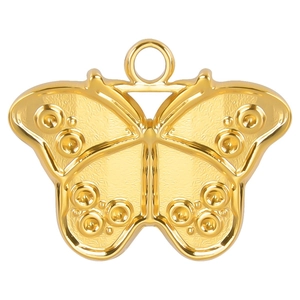 Macro shot of gold butterfly pendant showing intricate textures and metal details