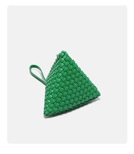 Detailed view of bright green woven triangular handbag with fine leather texture