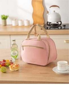 Detail of pink lunch bag with TASTY FOOD lettering and double zipper pockets