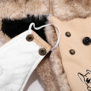 Detail of winter aviator hat featuring faux fur lining, quilting and embroidery