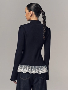 Slim fit black knitted top with elegant white lace hem and mock neck back view