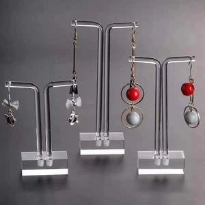 Three-tier clear acrylic earring display stands with multiple holes for jewelry storage