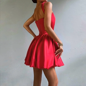 Detailed side-back view of red satin mini dress with elegant backless cut and draped skirt