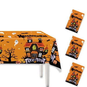 Halloween party set with orange PE tablecloth and trick or treat gift bags on white backdrop