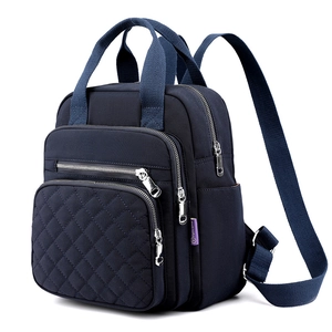 Navy blue nylon quilted backpack for women with diamond stitching and adjustable straps