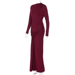 Detail view of burgundy long sleeve maxi dress featuring elegant side ruching and shoulder pads