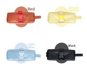 Detail view of the secure plastic buckle and side handle on a colorful stationery bag