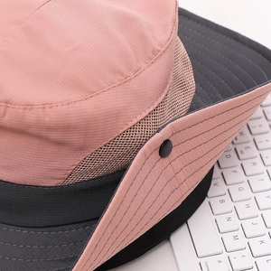 Close-up of pink outdoor sun hat featuring breathable mesh and reinforced wide brim
