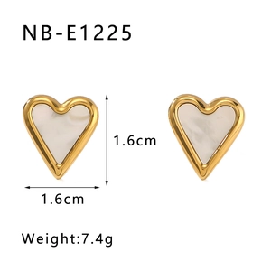 Detail showing 1.6cm white heart earrings with gold metal edges and pearl-like inlay