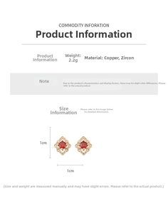 Détail macro de boucles d'oreilles vintage avec zircon rouge et base en cuivre poli