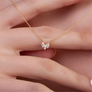 Detailed view of 925 silver necklace with three marquise-cut stones held on fingers