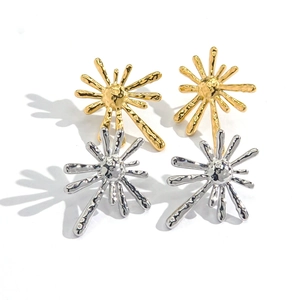 Fashionable 14K gold and silver sunburst stud earrings with hammered metal texture