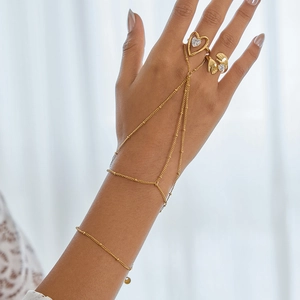 Bracelet bague à pampilles en maille dorée et ensemble de bagues en acier inoxydable