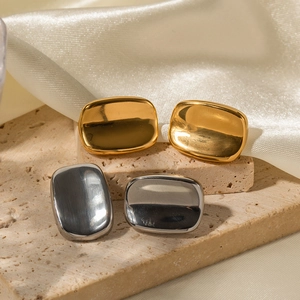 Minimalist rectangular gold and silver stainless steel studs on elegant stone