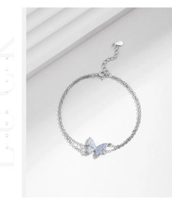 Detail of S925 silver double-layer bracelet featuring a blue butterfly pendant
