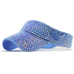 Detail of blue sun visor hat featuring sparkling AB rhinestones and crystal decorations