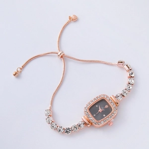 Detail of rose gold square watch with grey dial and adjustable rhinestone chain bracelet