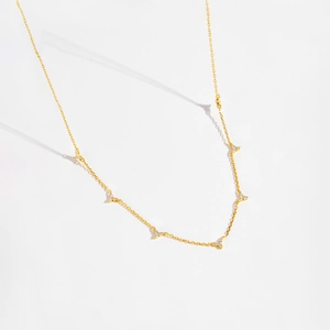 Minimalist S925 silver gold chain necklace with three-stone cluster charms on white background