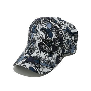 Detail shot of the sneaker graffiti print and stitched canvas on the baseball cap