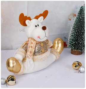 Detail of Christmas reindeer figurine with gold sequins and polka dot scarf decoration