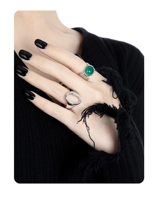 Close-up of S925 silver rings with green agate stone and wide cutout band on model