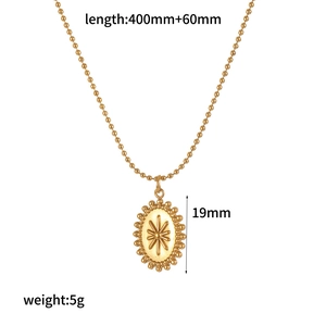 Detail of 18k gold plated moon necklace featuring oval starburst pendant and bead chain