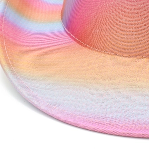 Detailed macro view of the rainbow gradient woven texture on the colorful cowboy hat