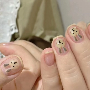 Adorable pink translucent short press-on nails featuring a cute cartoon rabbit design