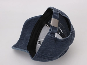Detail of blue washed cotton kids baseball cap showing silver metal adjustable buckle