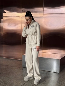 Chic beige loungewear set with zip-up drawstring sweatshirt and wide-leg joggers