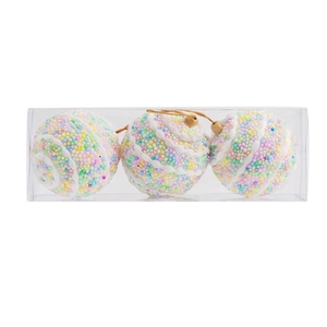 Detailed view of three 8cm Christmas ornaments with colorful foam beads in a clear box