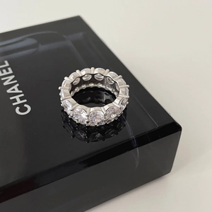 Detail shot of a sparkling S925 sterling silver eternity ring with zircon stones
