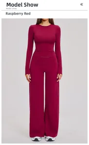 Detail of raspberry red yoga set featuring long sleeve top and high waist wide leg pants