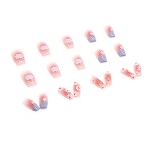 Pink and purple gradient press-on nails with white floral and cloud patterns
