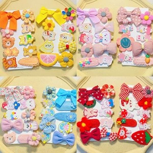 Detailed grid view of cute cartoon hair clips set with flowers, fruits, and animals