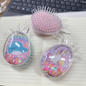 Detail of transparent air cushion combs featuring liquid glitter and cute cartoon prints