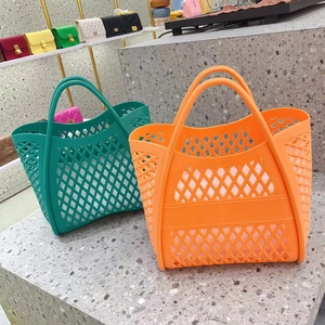 Hollow-out jelly tote bags in bright orange and green colors for beach and shopping