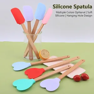 Silicone heart-shaped spatula set with beech wood handles in various colors for kitchen use