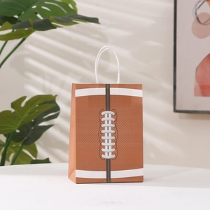 Brown kraft paper gift bag featuring white football stitching print and sturdy white handles