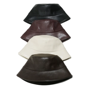 Minimalist solid color PU leather bucket hats in black, brown, cream, and mocha
