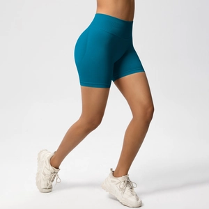 Macro detail of high-waist seamless compression fitness shorts in peacock blue color