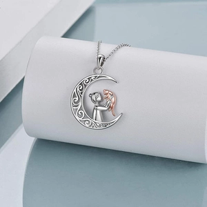 S925 silver hollow moon necklace with rose gold girl and cat pendant on white stand