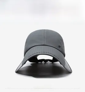 Detailed front view of a dark grey breathable sports cap with wide sun protection brim