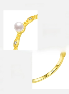 Macro view of gold-plated S925 sterling silver stud earring with pearl and zircon detail