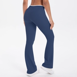 Rear view of navy high-waisted flared yoga pants with contrast waistband and lift seams
