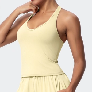 Close-up of a pale yellow V-neck racerback sports bra and high-waisted shorts set